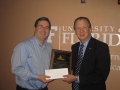 Dan Kane accepting award from Dean John Wright.