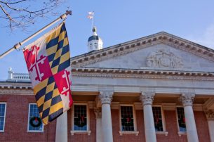 Picture of Maryland capitol building with Maryland flag.